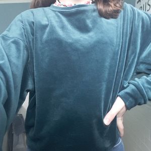 Super cute velvet like feel sweater .